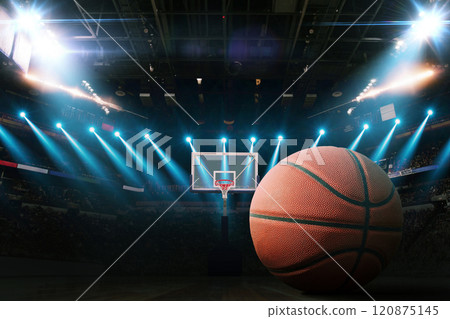 Basketball on the floor. Modern Basketball Arena with Rings with Spotlights, Creative Idea. Tournament and Win. Basketball game with full hall of fans on dark background. Basketball Championship. 120875145