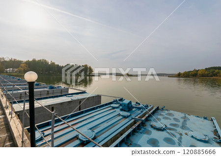 Pontoon bridge with a pier on the lake 120885666