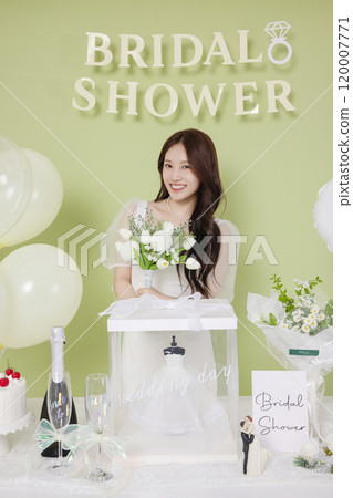 A woman in her 20s enjoying a bridal shower ahead of her wedding 120007771