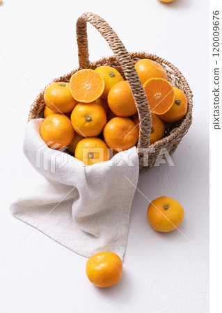 A basket full of fresh tangerines 120009676