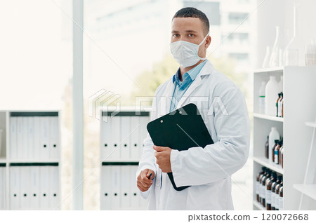 Lets get the world better again. Portrait of a confident young scientist wearing a mask in a modern laboratory. 120072668