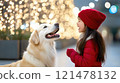 Joyful Child and Dog Celebrating Christmas Together 121478132