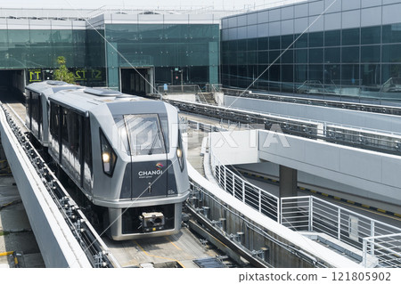 The Skytrain automated people mover (APM) at Singapore Changi Airport connects Terminals 1, 2, and 3.  121805902