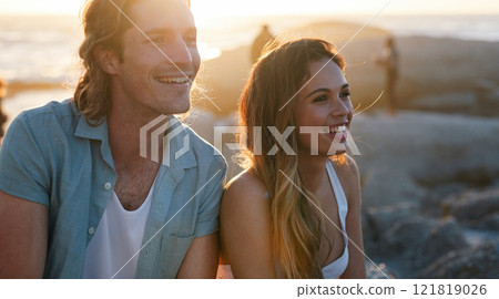 happy couple smiling on beach at sunset enjoying summer 121819026