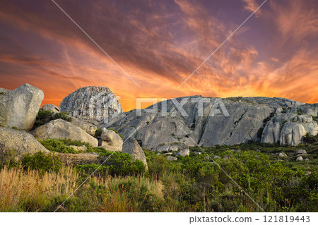 Beautiful, bright and ambient sky at sunset with big boulders outdoors on a nature landscape. Dramatic scene of the wilderness at dawn in a natural, secluded and untouched wilderness environment 121819443