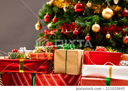 Presents and christmas tree with baubles, decorations and copy space 121020645