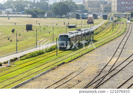 The circular light rail train drives past Hamasen Railway Cultural Park in Kaohsiung, Taiwan. 121076935