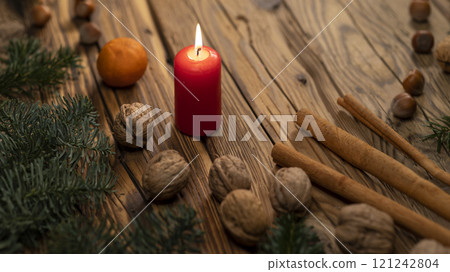 Traditional Czech Christmas on wood decoration with twig, candle, apple, orange, fruit 121242804