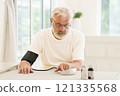 Senior man measuring blood pressure 121335568