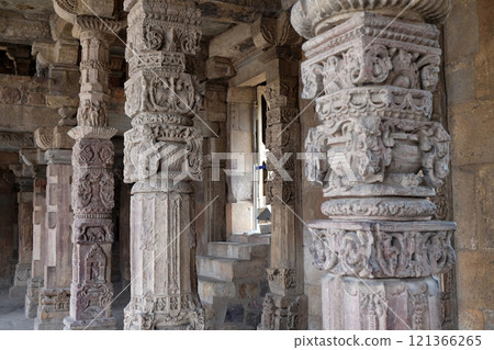 Columns with stone carving in courtyard of Quwwat-Ul-Islam mosque, Qutub Minar complex, Delhi, India 121366265