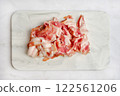 Freshly chopped pork bacon on a marble cutting board ready for cooking 122561206