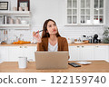 Asian young woman seriously working on computer laptop in house 122159740