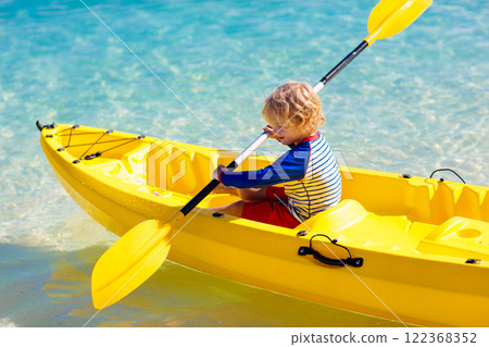 Kids kayaking in ocean. Family in kayak in tropical sea 122368352