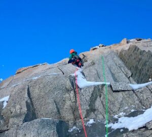 a climber on a mixed route on granite slabs