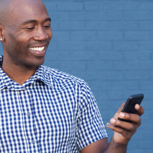 African-American man having a good experience using government technology.