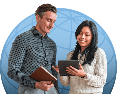 Two professional colleagues looking over a tablet together.