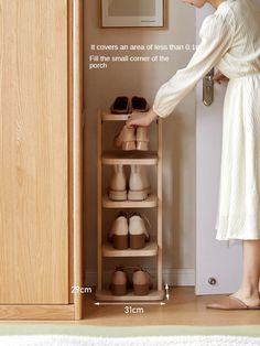 a woman standing in front of a closet filled with shoes