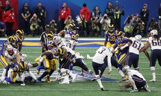 a group of football players on the field during a game