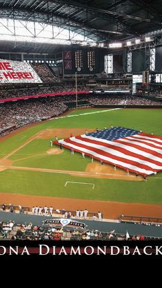 a baseball field with an american flag on it