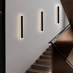 the stairs are lit up with modern lighting