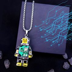 Unleash your inner tech enthusiast with our one-of-a-kind Robot Pendant Necklace. This wearable work of art seamlessly blends geeky charm with elegant design. 🤖 This pendant showcases a meticulously detailed robot silhouette. Its circuit board-inspired pattern adds an intriguing twist. Whether you're a tech aficionado or simply appreciate distinctive jewelry, this necklace suits all genders and styles. Wear it proudly to express your love for all things tech. Robot Silhouette, Tech Enthusiast, Geeky Jewellery, Tech Jewelry, Necklace Unique, Unisex Accessories, Circuit Board, Star Fashion, Mini Figures