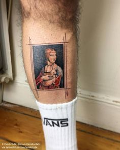 a man with a tattoo on his leg