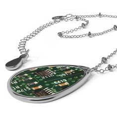 "Flip Technology Inside Out with Our Circuitboard Necklace!  Are you tired of conforming to societal norms and want to embrace your rebellious side? Our Circuitboard Necklace is here to help you do just that! This necklace is not your average piece of jewelry - it's a bold statement that challenges the status quo. The unique ellipse-shaped pendant is made with aluminum and designed to resemble an actual PCB*, flipping technology inside out and showcasing its raw beauty. The brass chain and pendant are built to last and offer a dazzling appearance that's sure to catch everyone's attention. But that's not all - our Circuitboard Necklace also features a lobster clasp closure that ensures a secure fit for all-day wear. You can now show off your rebellious side without worrying about losing you Science Inspired Jewelry, Cheap Adjustable Fandom Jewelry, Mother Board Computer Jewelry, Edforce Jewelry, Pcb Jewelry, Tech Necklace, Coder Girl, Girl Geek, Societal Norms