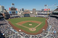 an aerial view of a baseball stadium with many fans in the stands and onlookers