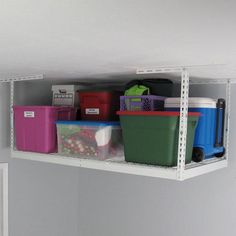 the shelves are filled with plastic containers and bins for storing items or other things