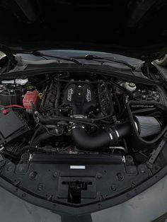 the engine compartment of a car with its hood open