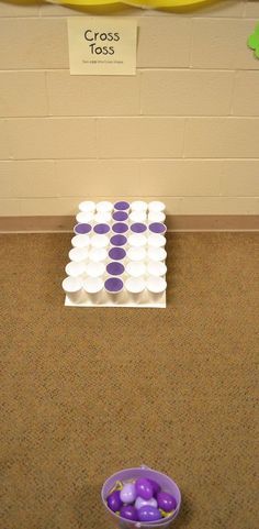 purple and white eggs are in a bowl on the floor next to a banana sign