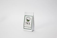 a bag of tea sitting on top of a white table