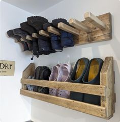 a wooden shoe rack with shoes hanging on it