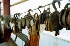 several different types of hooks hanging on a line