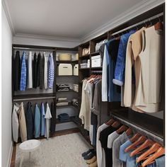 a walk in closet filled with lots of clothes