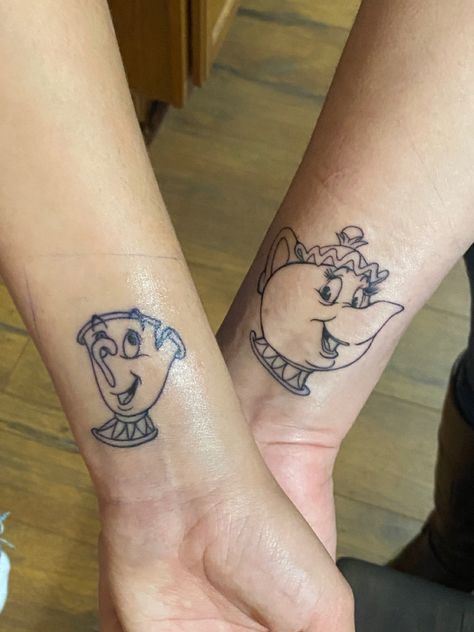 disney’s beauty & the beast chip & mrs. potts black ink wrist tattoo Chip And Mrs Potts Tattoo, Mrs Potts Tattoo, Mrs Potts And Chip Tattoo, Chip Tattoo, Mrs Potts And Chip, Mrs Potts, Disney Tattoo, Disney Tattoos, Tattoo Ideas