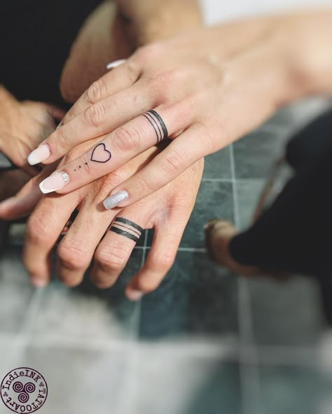 30+ Unisex Wedding Ring Tattoos for Couples - 100 Tattoos Couple Tattoos For Finger, Marriage Hand Tattoo, Matching Tattoo Wedding Bands, Ring Tattoo Ideas Women, Married Couple Hand Tattoos, Top Finger Tattoo, Couple Tattoo Ring Finger, Tattoo Ideas For Ring Finger, Womens Wedding Ring Finger Tattoo