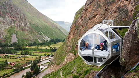 Sleeping pods on cliff face above Peru's Sacred Valley (Credit: Natura Vive)