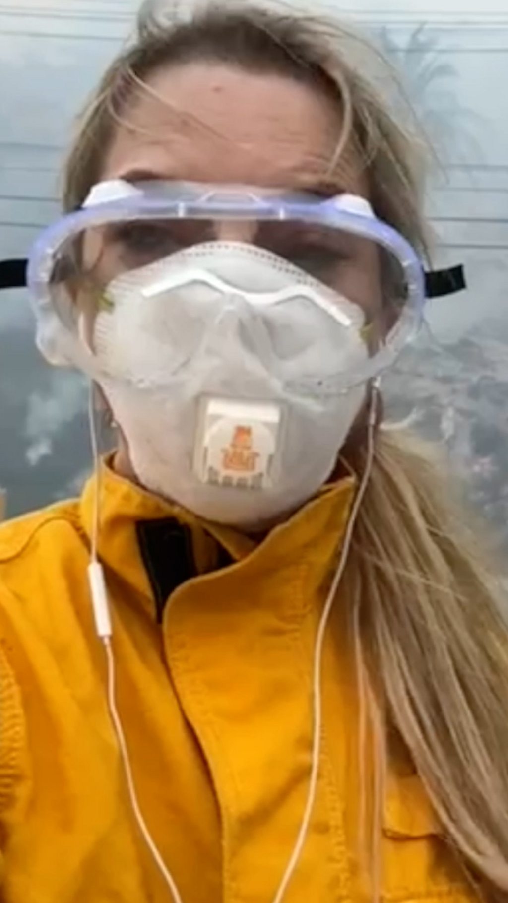 Emma Vardy wearing protective eye goggles and face mask