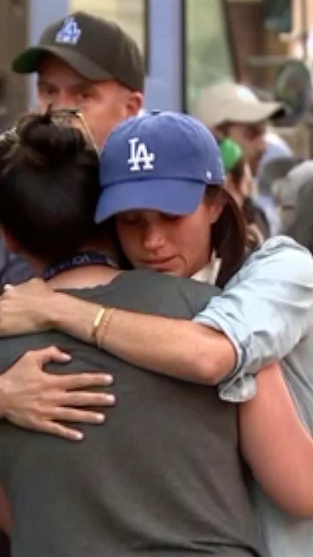 Prince Harry and Meghan hug residents in Pasadena