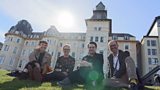 Group photo of the UXA team sitting on the grass.