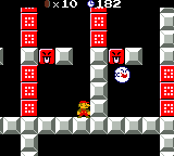 A screenshot of World 1-4 (VS Game) in Super Mario Bros. Deluxe, showing, among other things, Small Mario, a Boo, Face Blocks, and Dotted-Line Blocks.