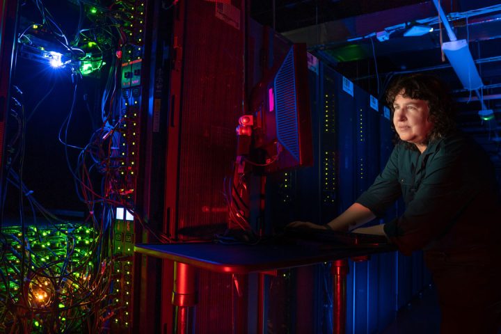 A scientist works on the JASMIN super computer.