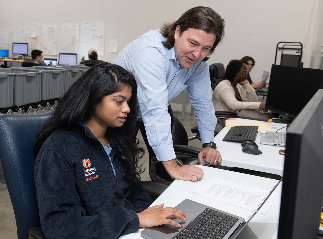 An instructor and student in a classroom