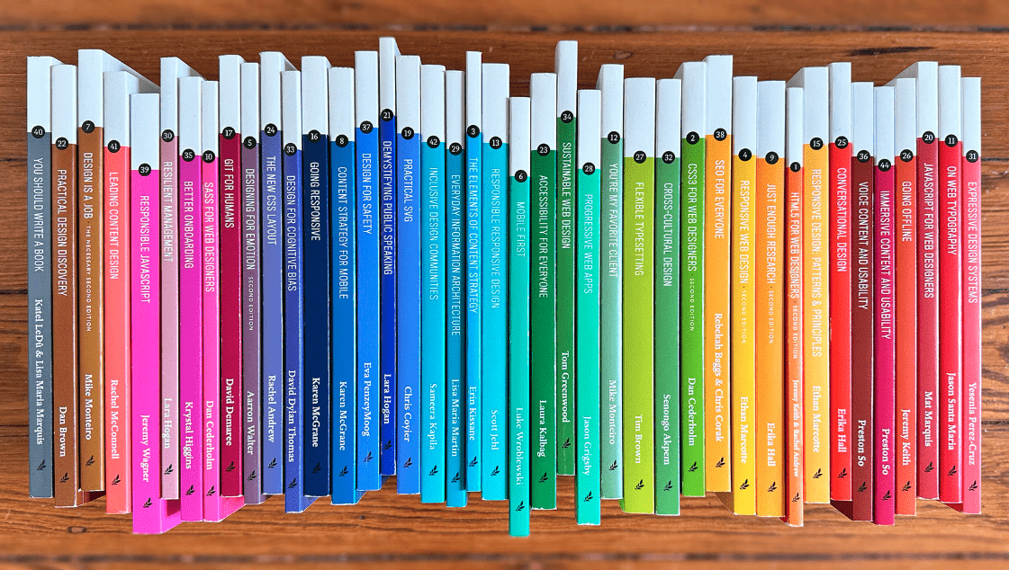 Colorful books lined up forming a rainbow