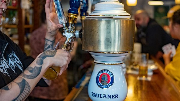 Photo of Die BierStube - Seattle, WA, US. a bartender pouring a beer