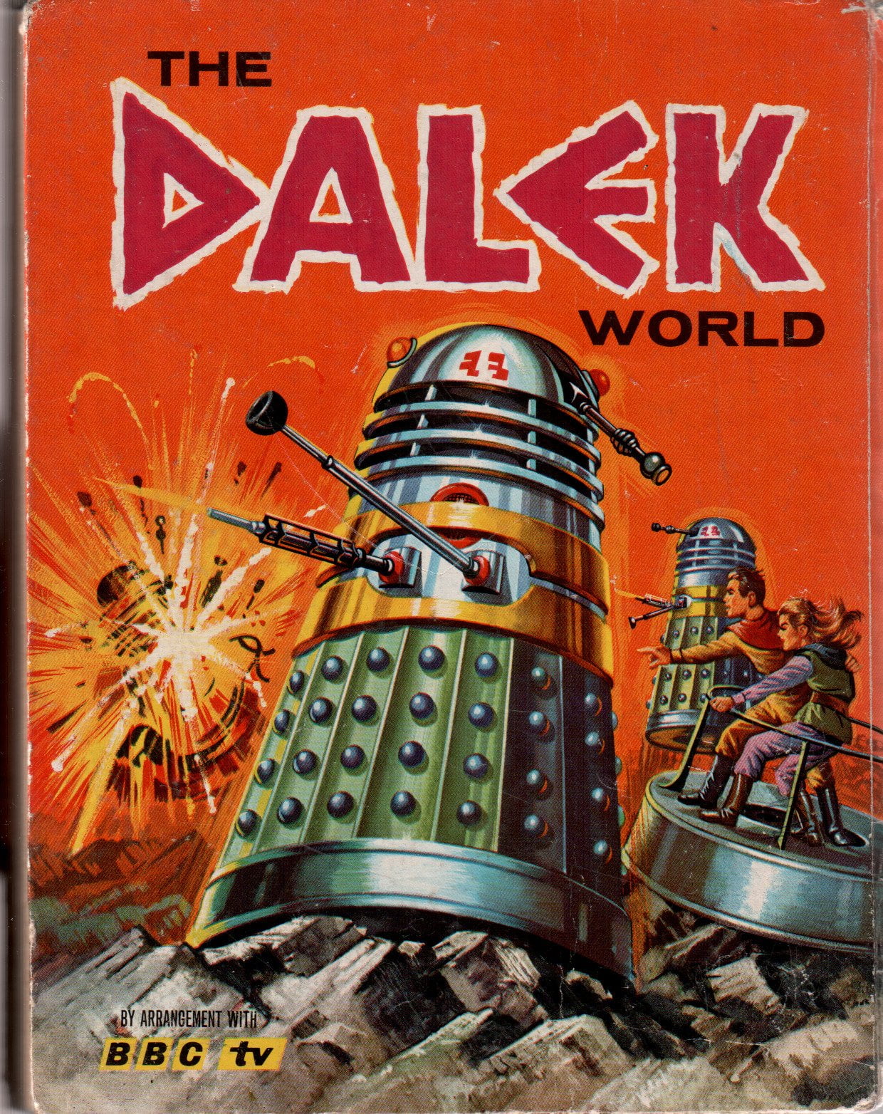 Garish cartoon cover of an annual. A Dalek is exterminating something.