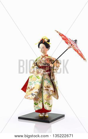 Japanese geisha dolls on the white background.