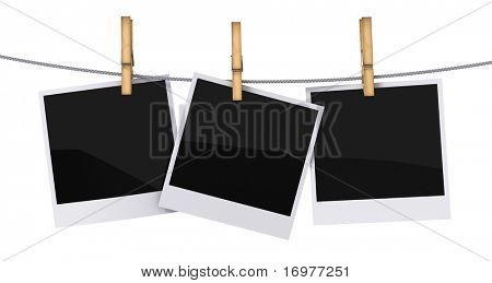 Blank photo frames hanging on a rope