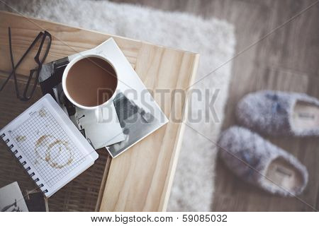 Still life details, cup of coffee and retro vintage black-and-white photos, top view point